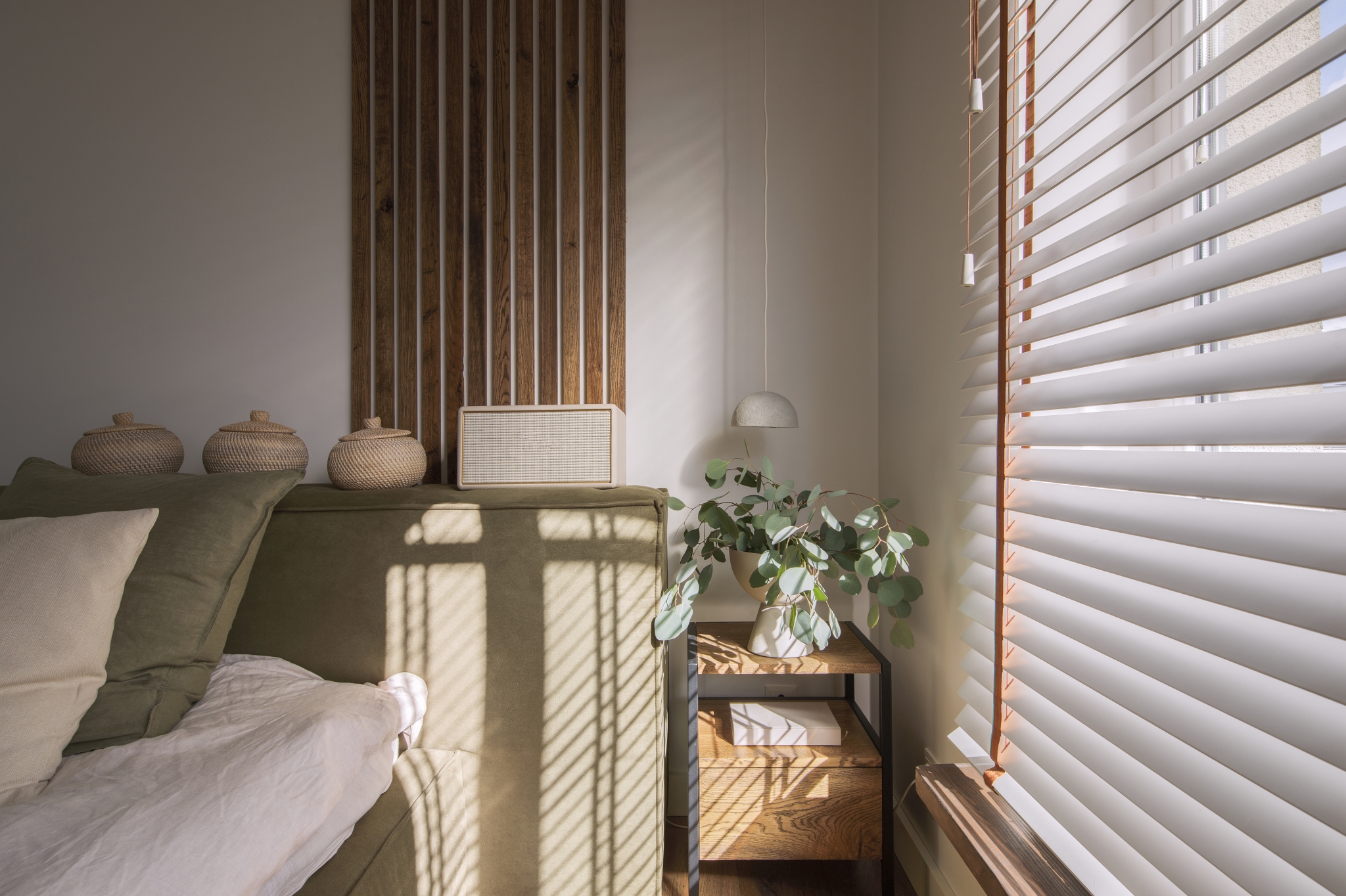 Modern Japandi appartment interior design in earth tones, natural textures with wooden solid oak furniture and sliding Japanese wood doors. Japandi concept