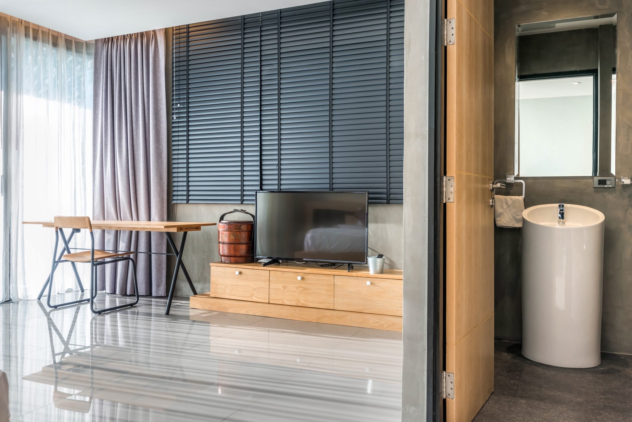 luxury-bathroom-features-toilet-bowl-bedroom-with-television-desk